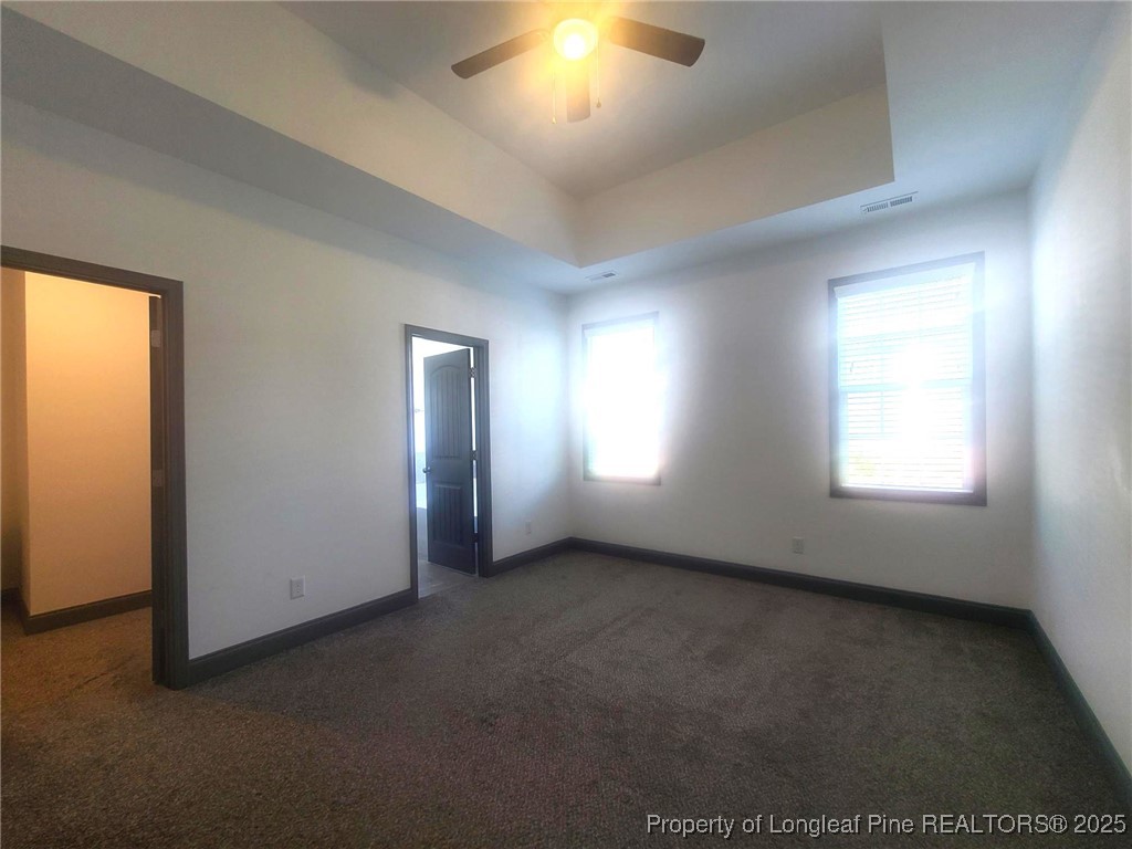 519 Hammond Farms Road Hope Mills, NC 28348 - Photo 20 of 34 an empty room with windows and fireplace