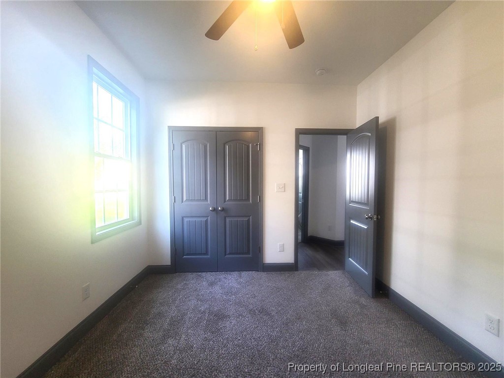 519 Hammond Farms Road Hope Mills, NC 28348 - Photo 24 of 34 an empty room with windows and closet