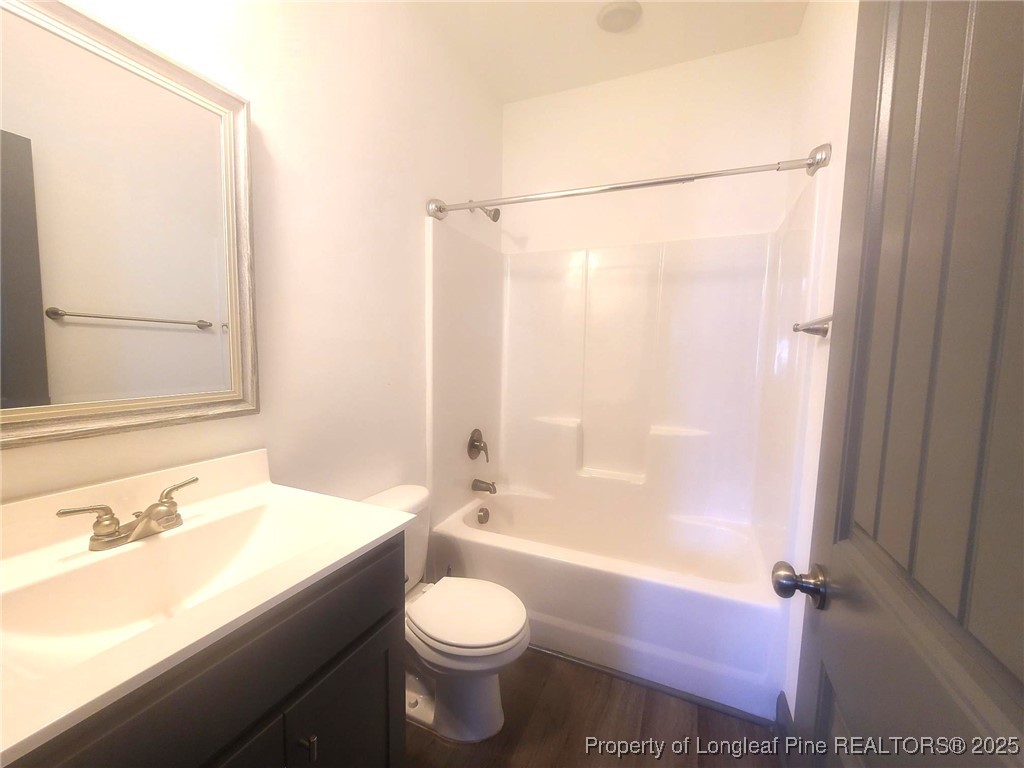 519 Hammond Farms Road Hope Mills, NC 28348 - Photo 26 of 34 a bathroom with a sink a toilet and shower