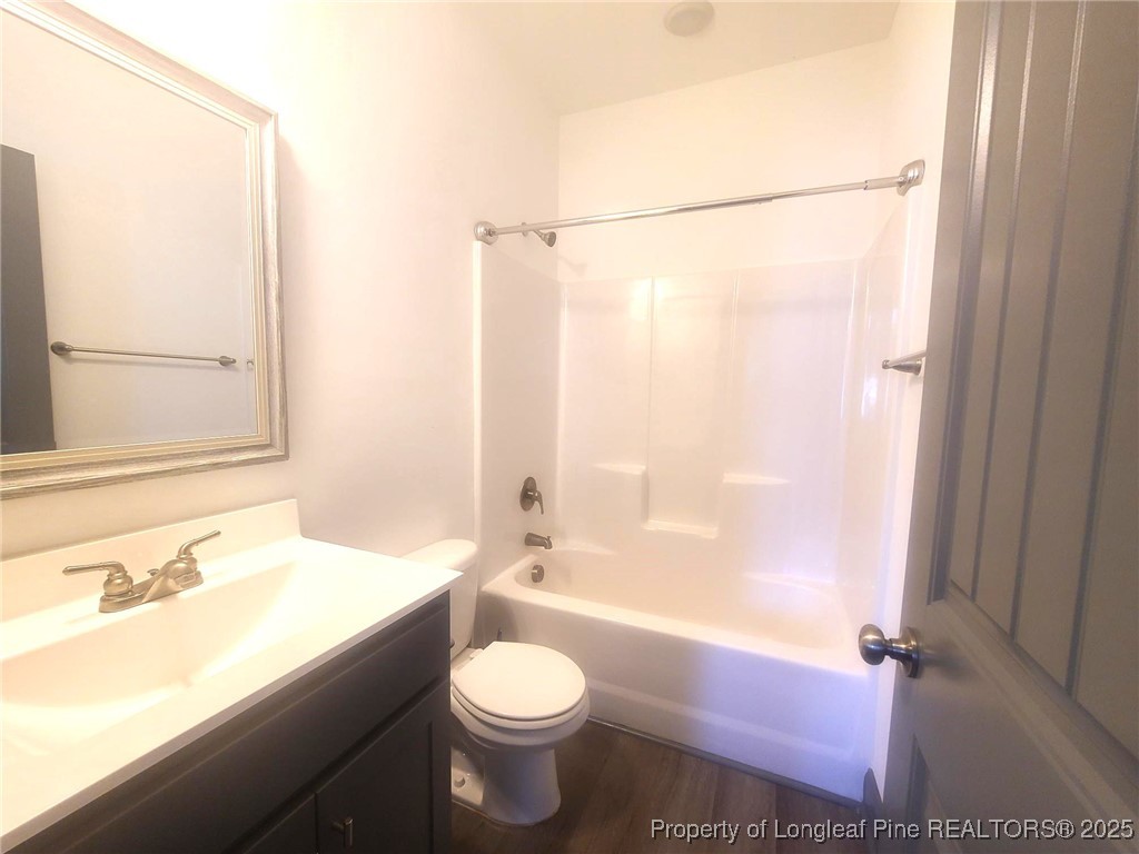519 Hammond Farms Road Hope Mills, NC 28348 - Photo 27 of 34 a bathroom with a sink toilet and shower