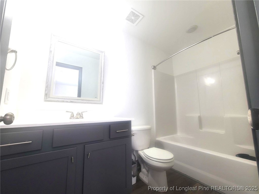 519 Hammond Farms Road Hope Mills, NC 28348 - Photo 34 of 34 a bathroom with a sink a toilet and shower