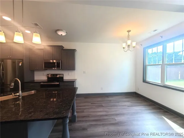 a kitchen with sink and window