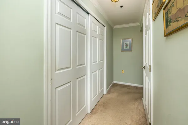 a bed room with a bed and a ceiling fan