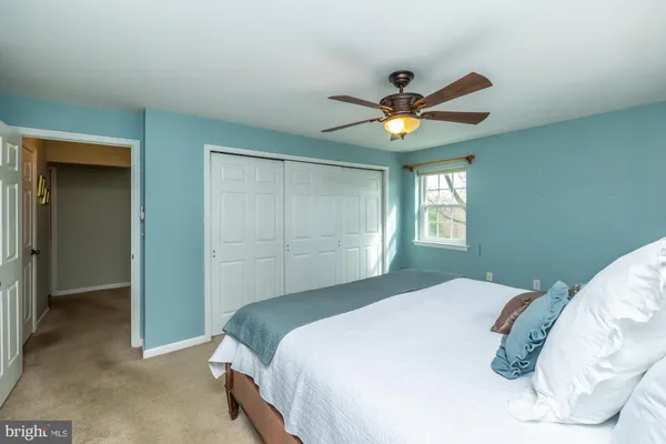 a bathroom with a granite countertop shower and a sink