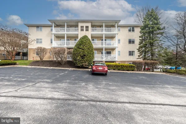 a view of a street with a building in the background