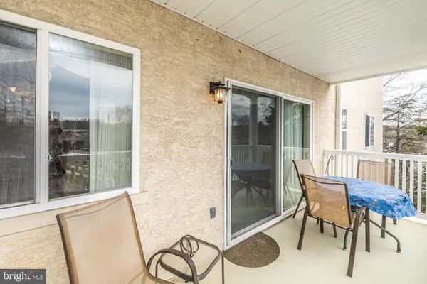 a view of a balcony with chairs