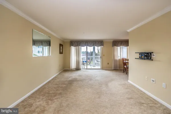 a view of a livingroom with furniture and windows