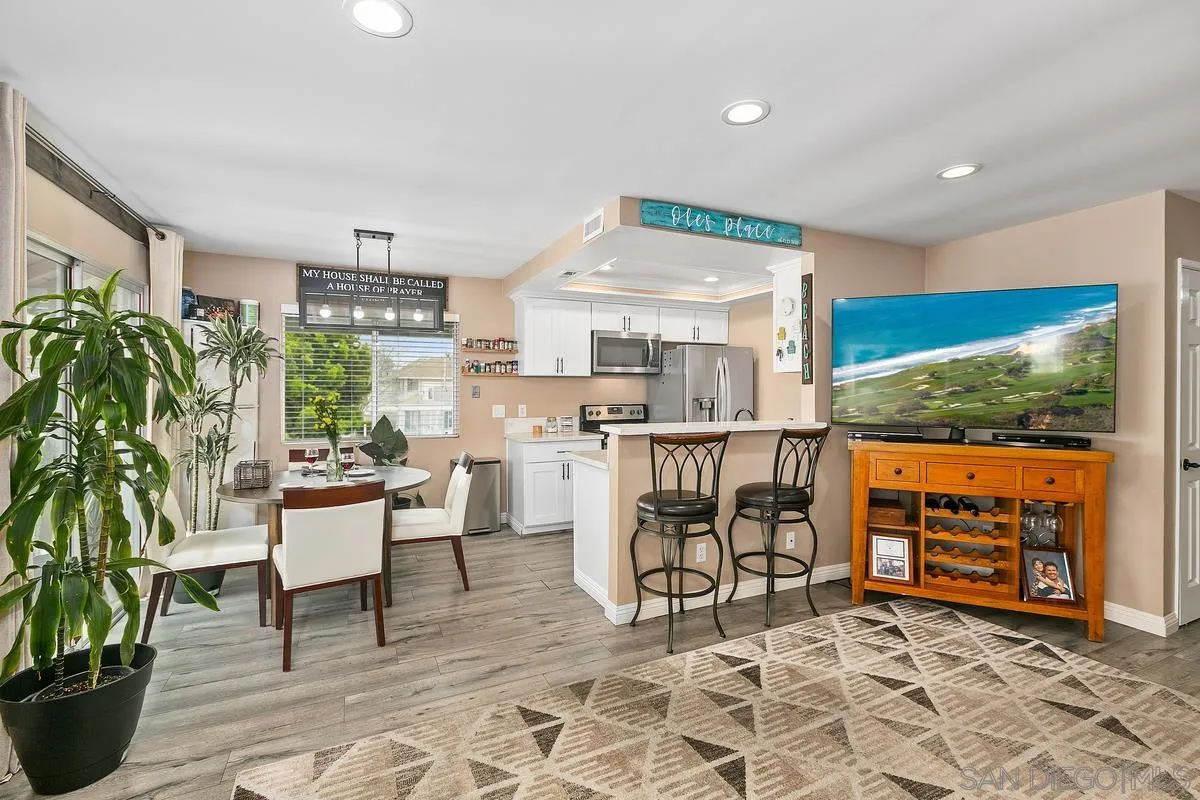 750 Timber Cove Way Oceanside, CA 92058 - Photo 1 of 26 a living room with lots of furniture and kitchen view