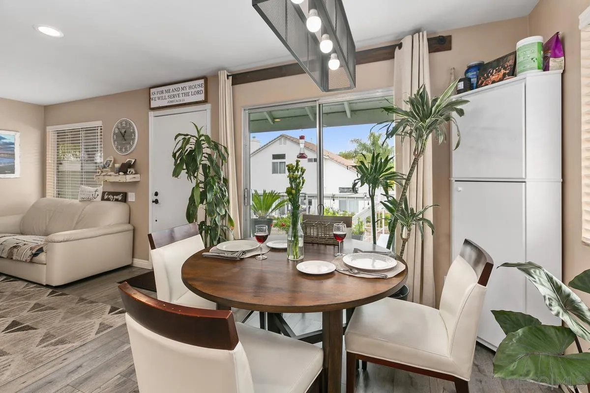 750 Timber Cove Way Oceanside, CA 92058 - Photo 12 of 26 a view of a dining room with furniture and a potted plant
