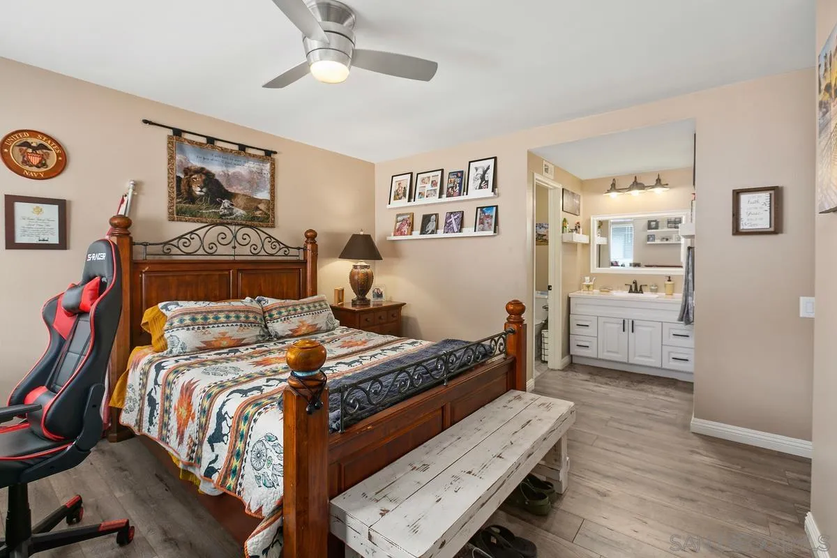 750 Timber Cove Way Oceanside, CA 92058 - Photo 16 of 26 a bedroom with furniture and a window