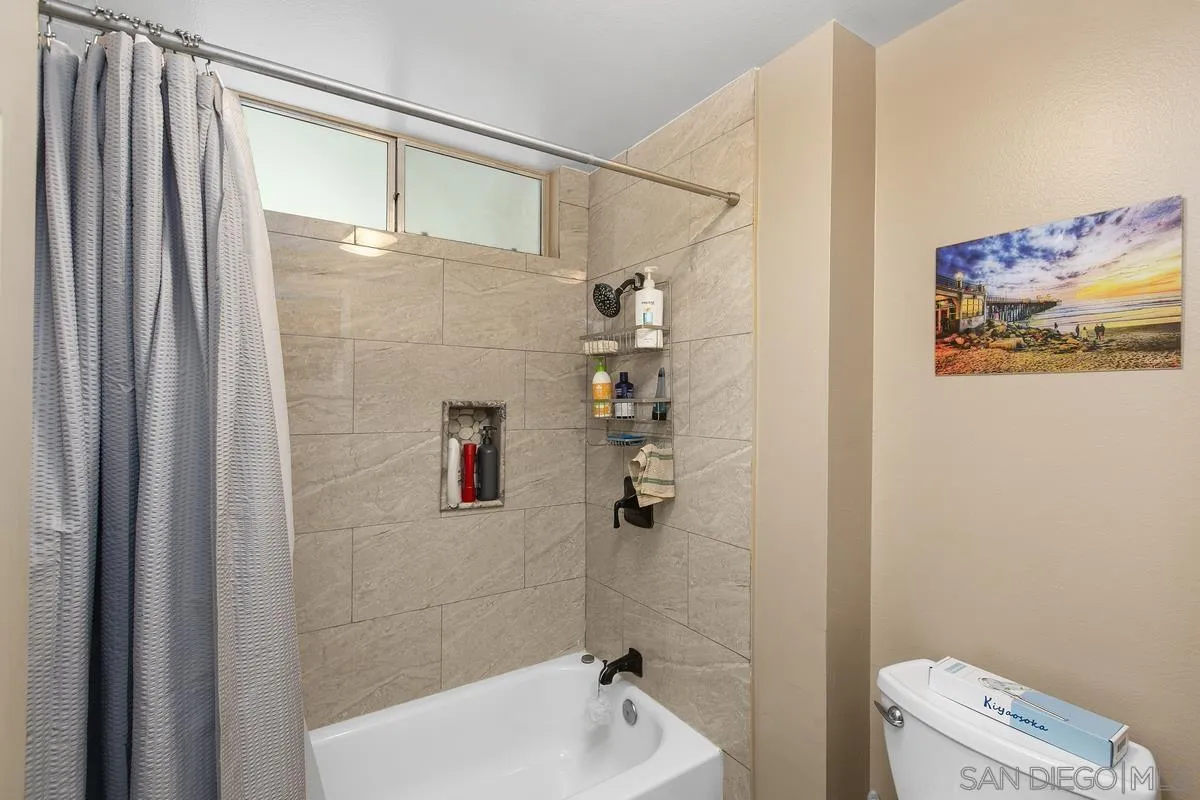 750 Timber Cove Way Oceanside, CA 92058 - Photo 19 of 26 a bathroom with a shower and a toilet
