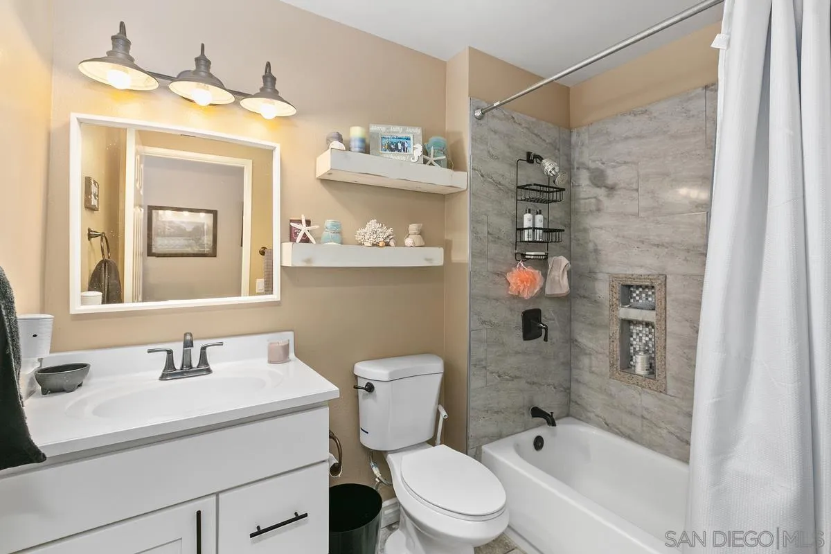 750 Timber Cove Way Oceanside, CA 92058 - Photo 22 of 26 a bathroom with a sink a toilet and shower