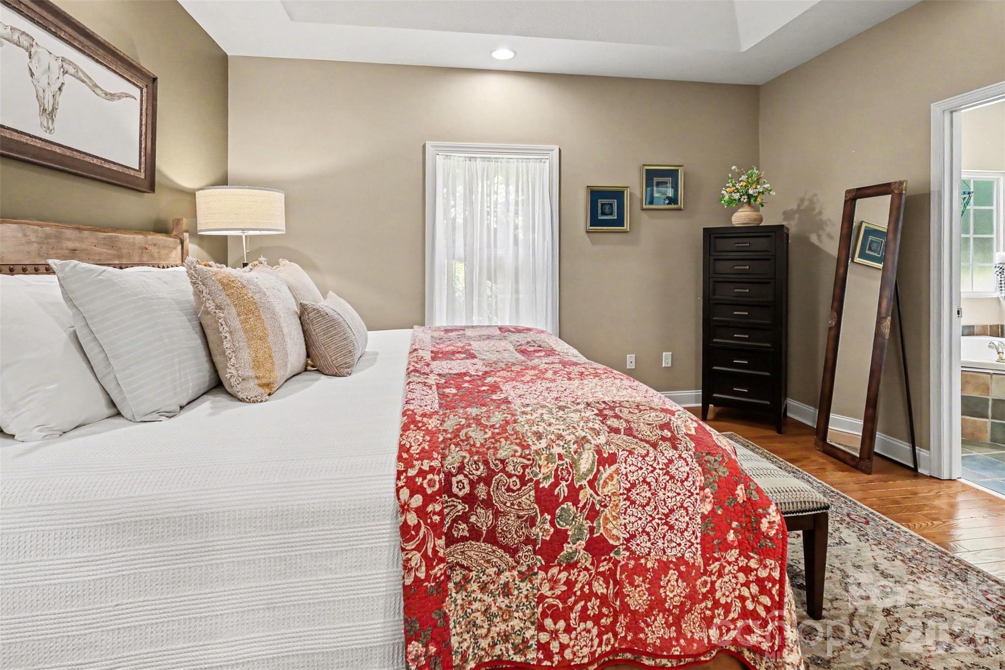 4037 Old Williamston Road Belton, SC 29627 - Photo 16 of 41 a bedroom with a bed and wooden floor