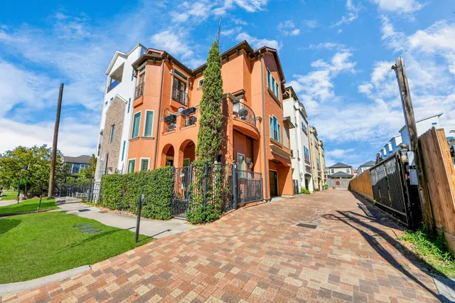 a view of a white building among the street