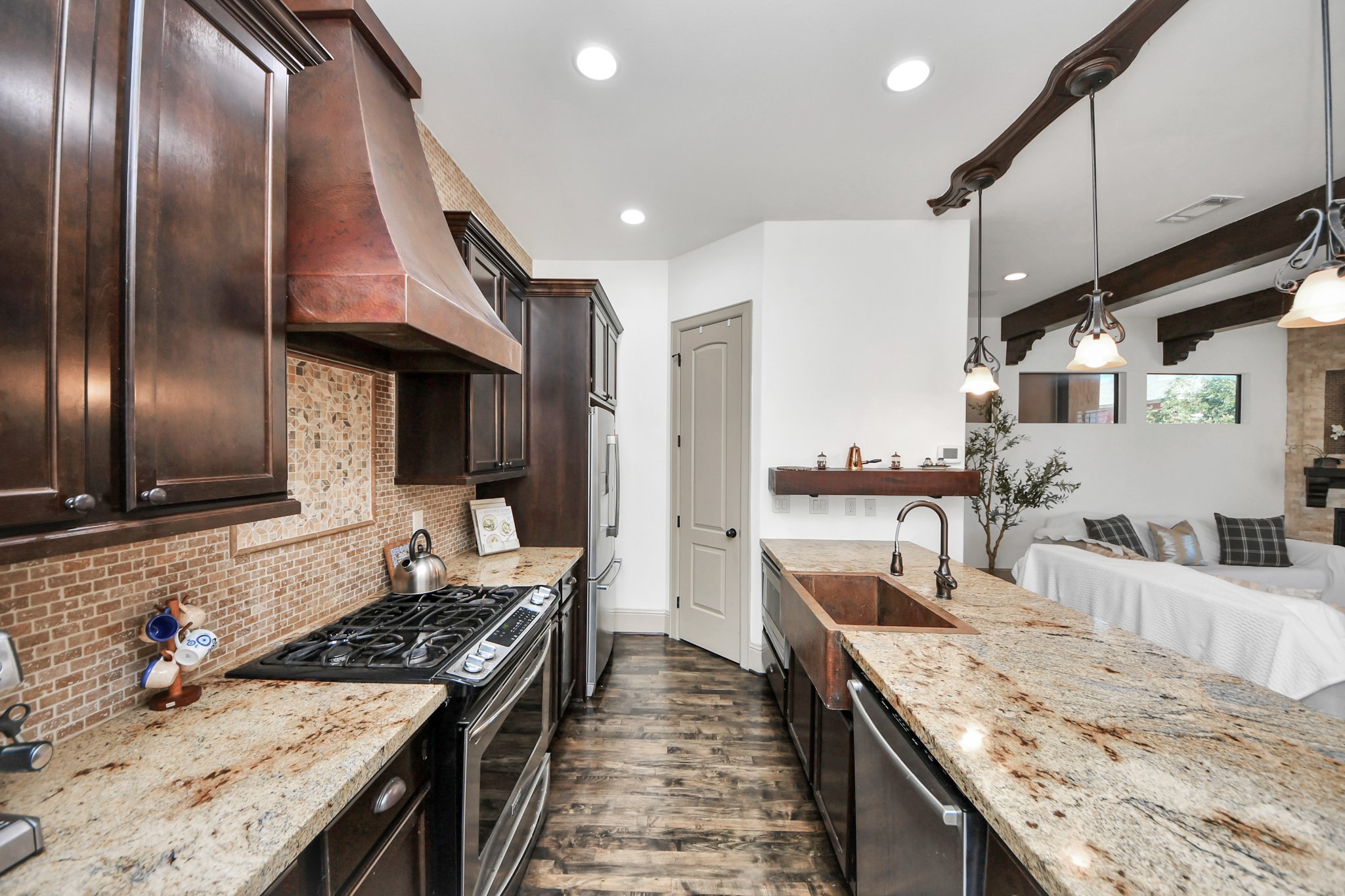 1141 West 23rd Street, Unit A Houston, TX 77008 - Photo 15 of 35 a large kitchen with stainless steel appliances granite countertop a lot of counter space and a sink