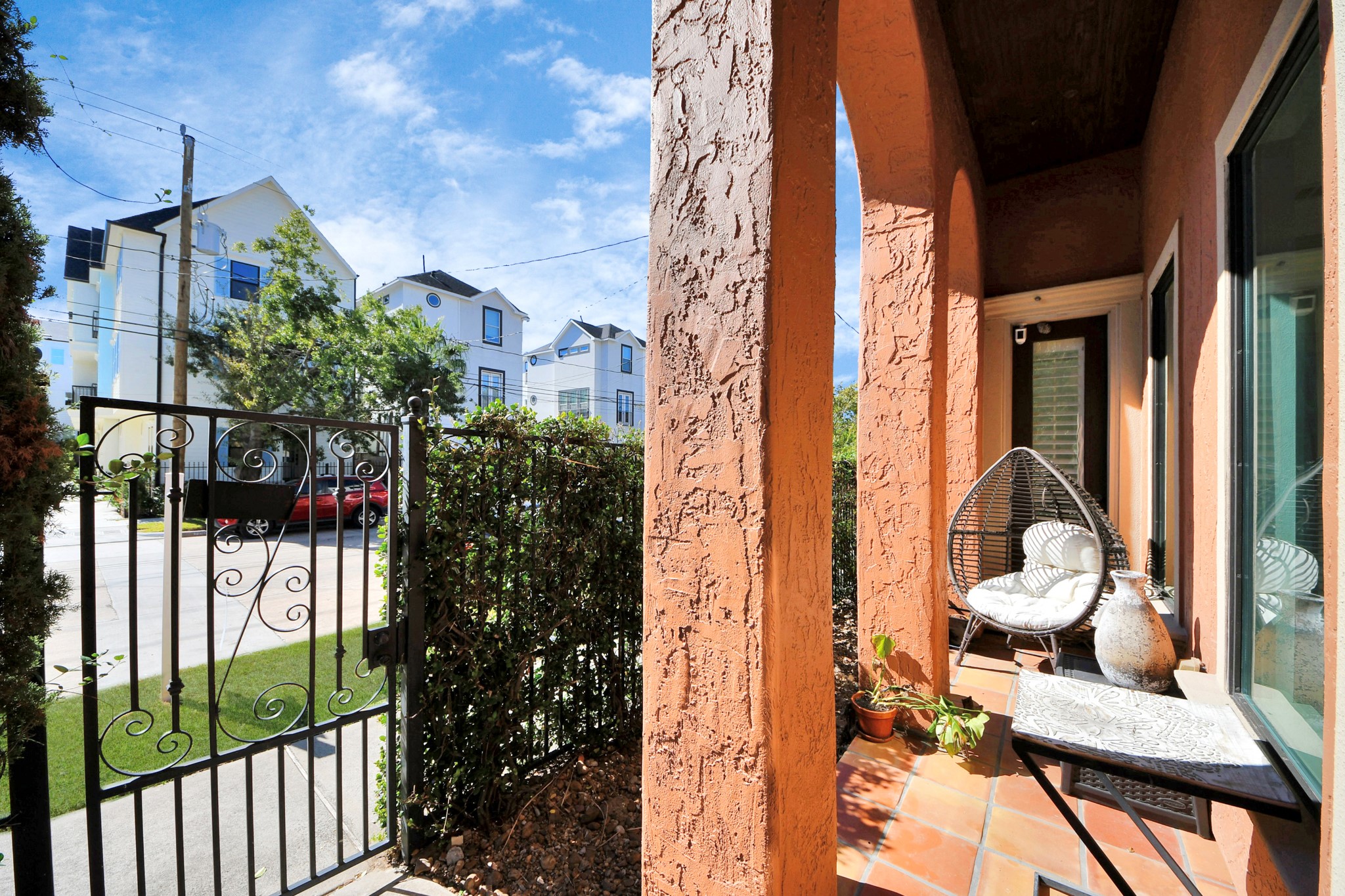 1141 West 23rd Street, Unit A Houston, TX 77008 - Photo 2 of 35 a view of a balcony with chairs and potted plants