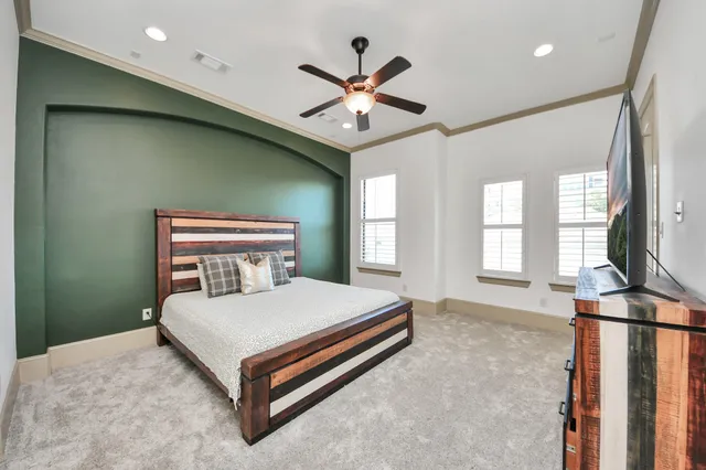 a bedroom with a bed and window