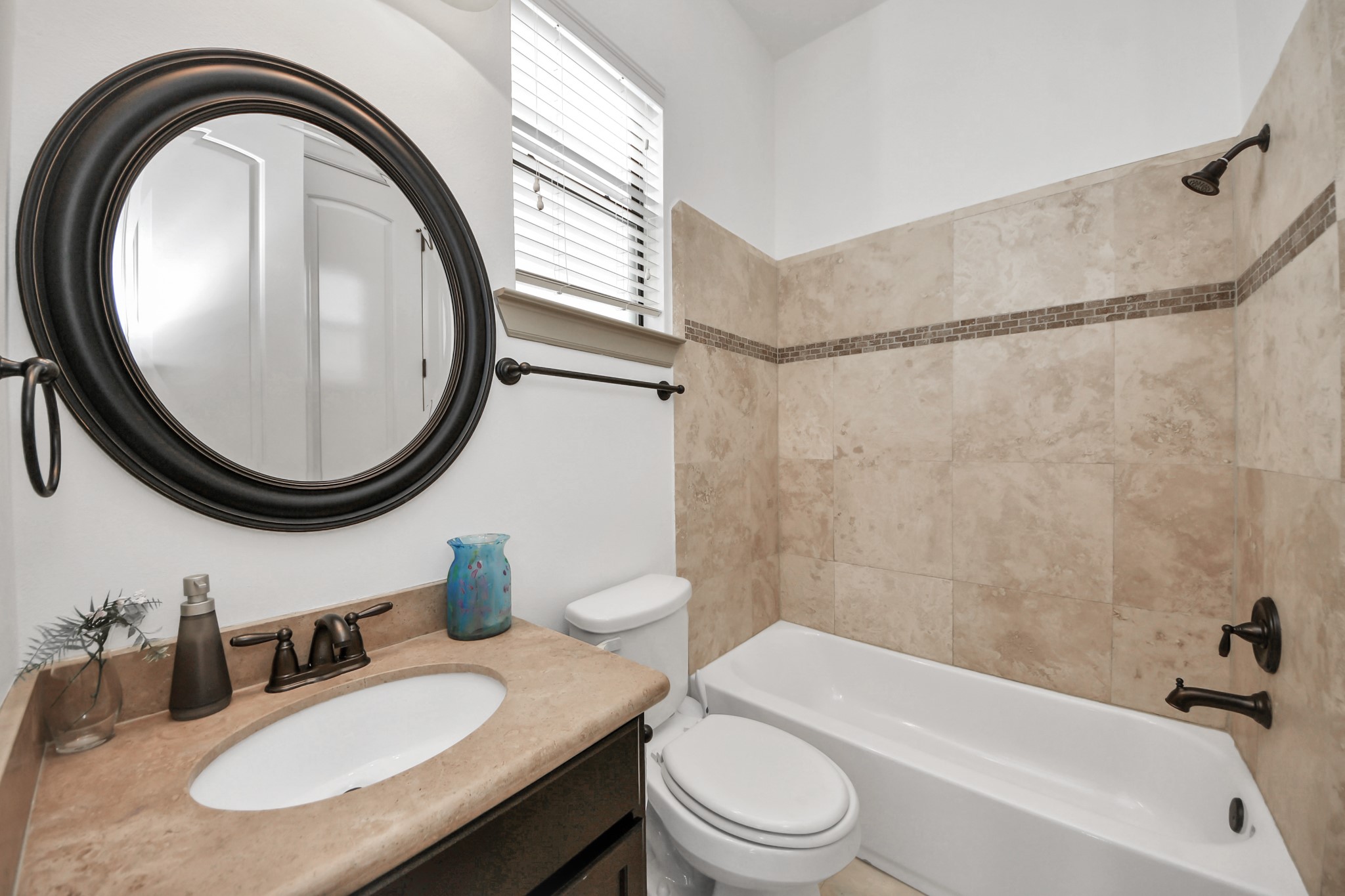 1141 West 23rd Street, Unit A Houston, TX 77008 - Photo 28 of 35 a bathroom with a sink a toilet and a mirror