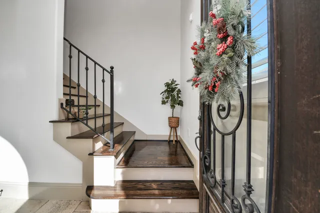 a view of entryway with flower pots