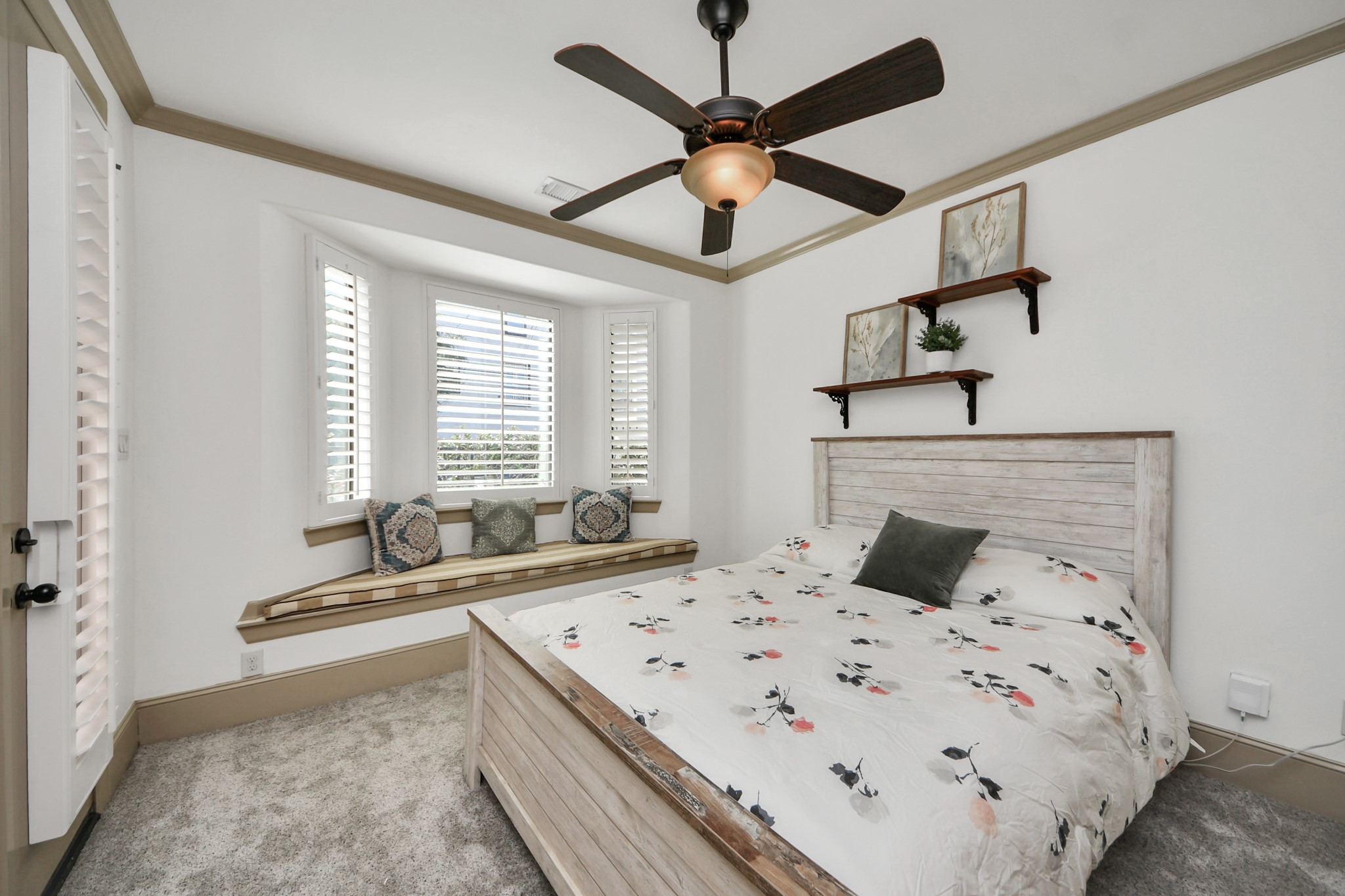 1141 West 23rd Street, Unit A Houston, TX 77008 - Photo 6 of 35 a bedroom with a bed and ceiling fan