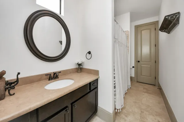 a bathroom with a sink and a mirror