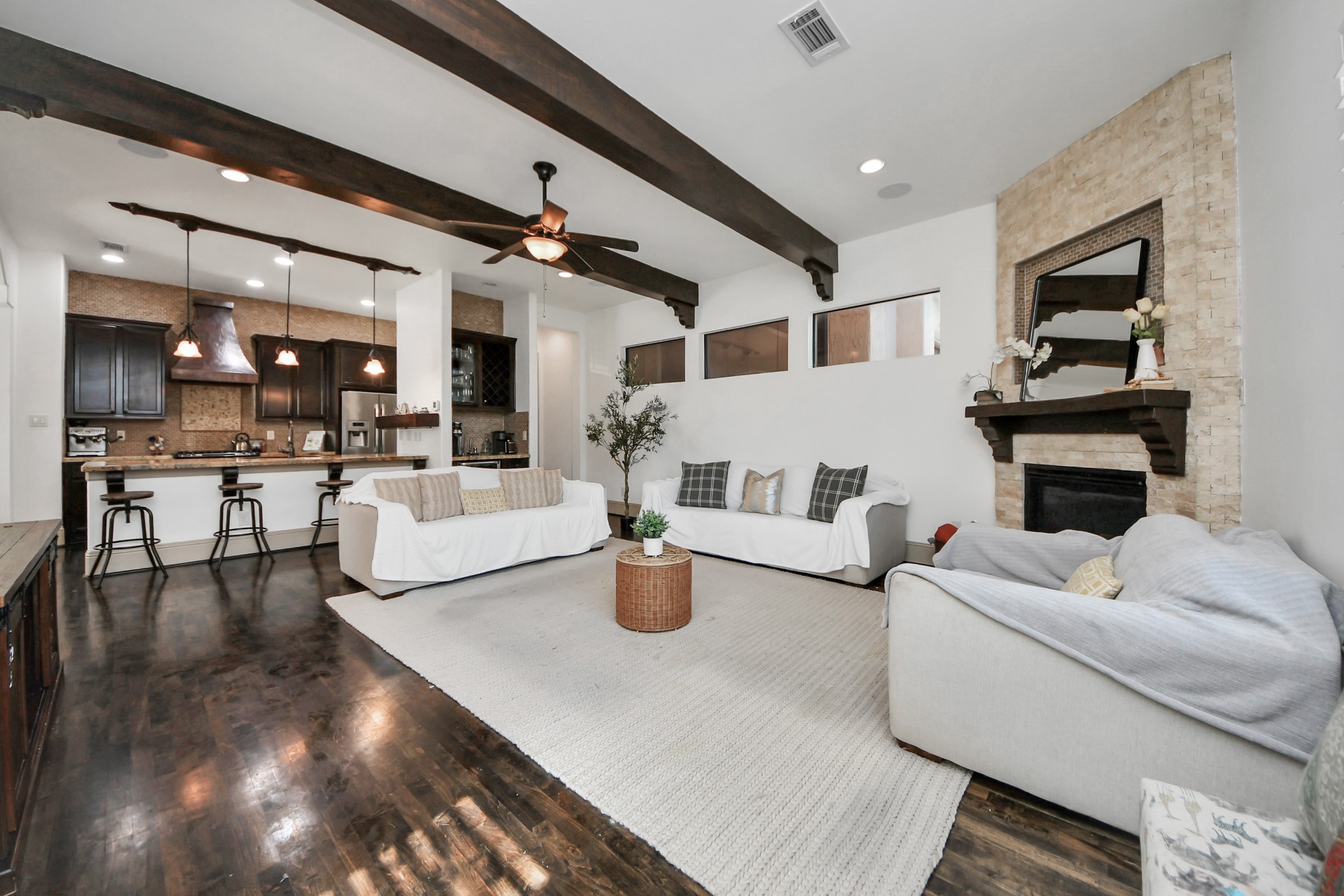1141 West 23rd Street, Unit A Houston, TX 77008 - Photo 10 of 35 a living room with fireplace furniture and a kitchen view