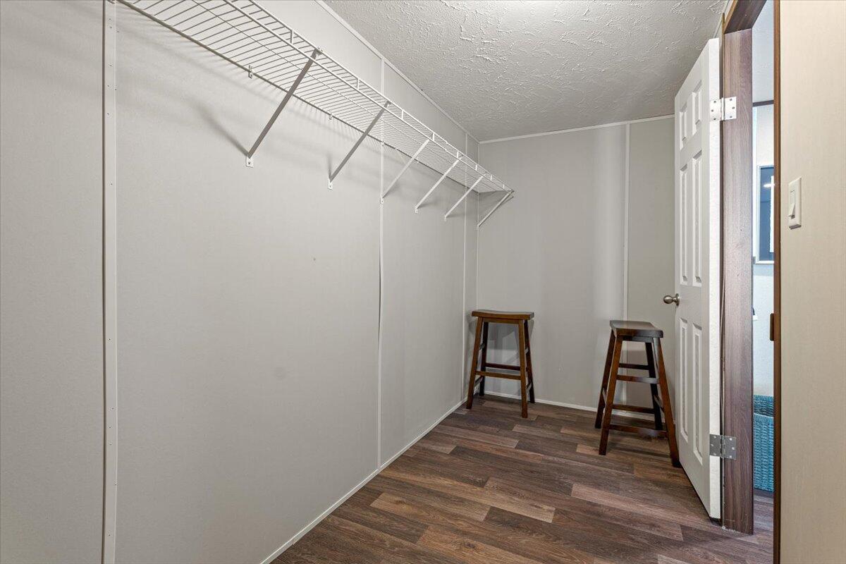 516 Sage Road Tahoka, TX 79373 - Photo 14 of 30 a view of a room with wooden floor and entryway
