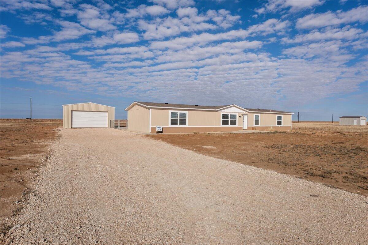 516 Sage Road Tahoka, TX 79373 - Photo 2 of 30 a house with a yard