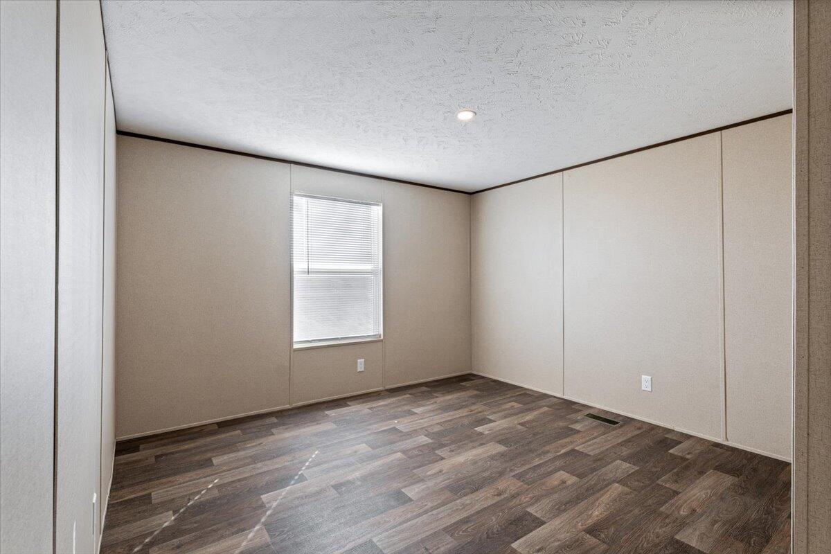 516 Sage Road Tahoka, TX 79373 - Photo 24 of 30 a view of an empty room with a window