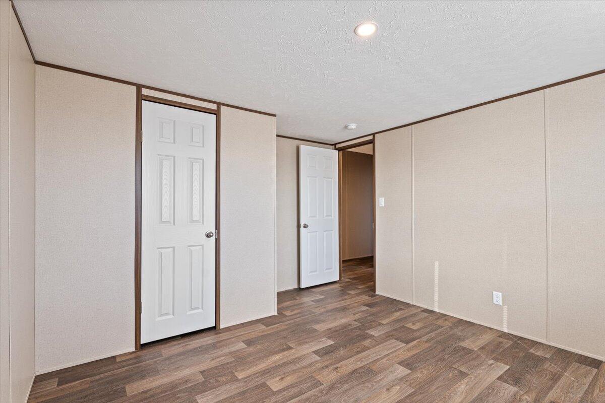 516 Sage Road Tahoka, TX 79373 - Photo 25 of 30 a view of empty room with wooden floor