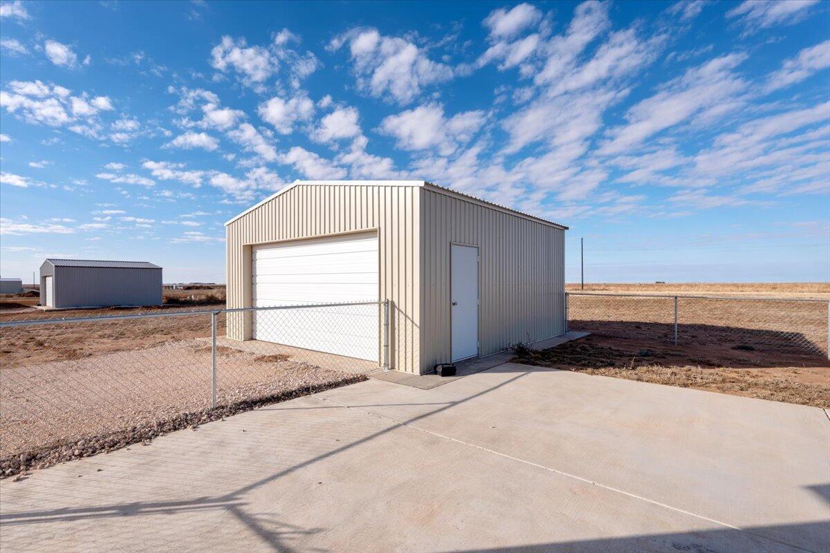 516 Sage Road Tahoka, TX 79373 - Photo 27 of 30 a view of a backyard of a house