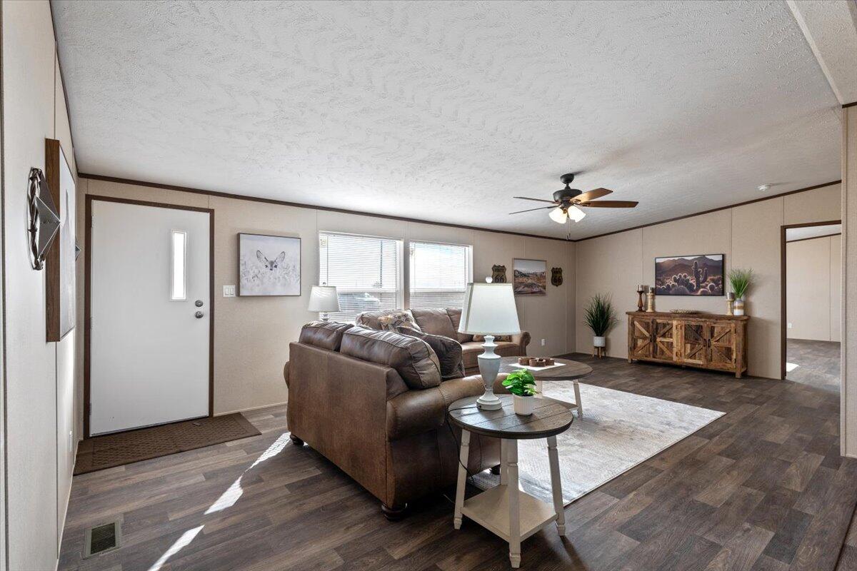 516 Sage Road Tahoka, TX 79373 - Photo 4 of 30 a living room with furniture and a wooden floor