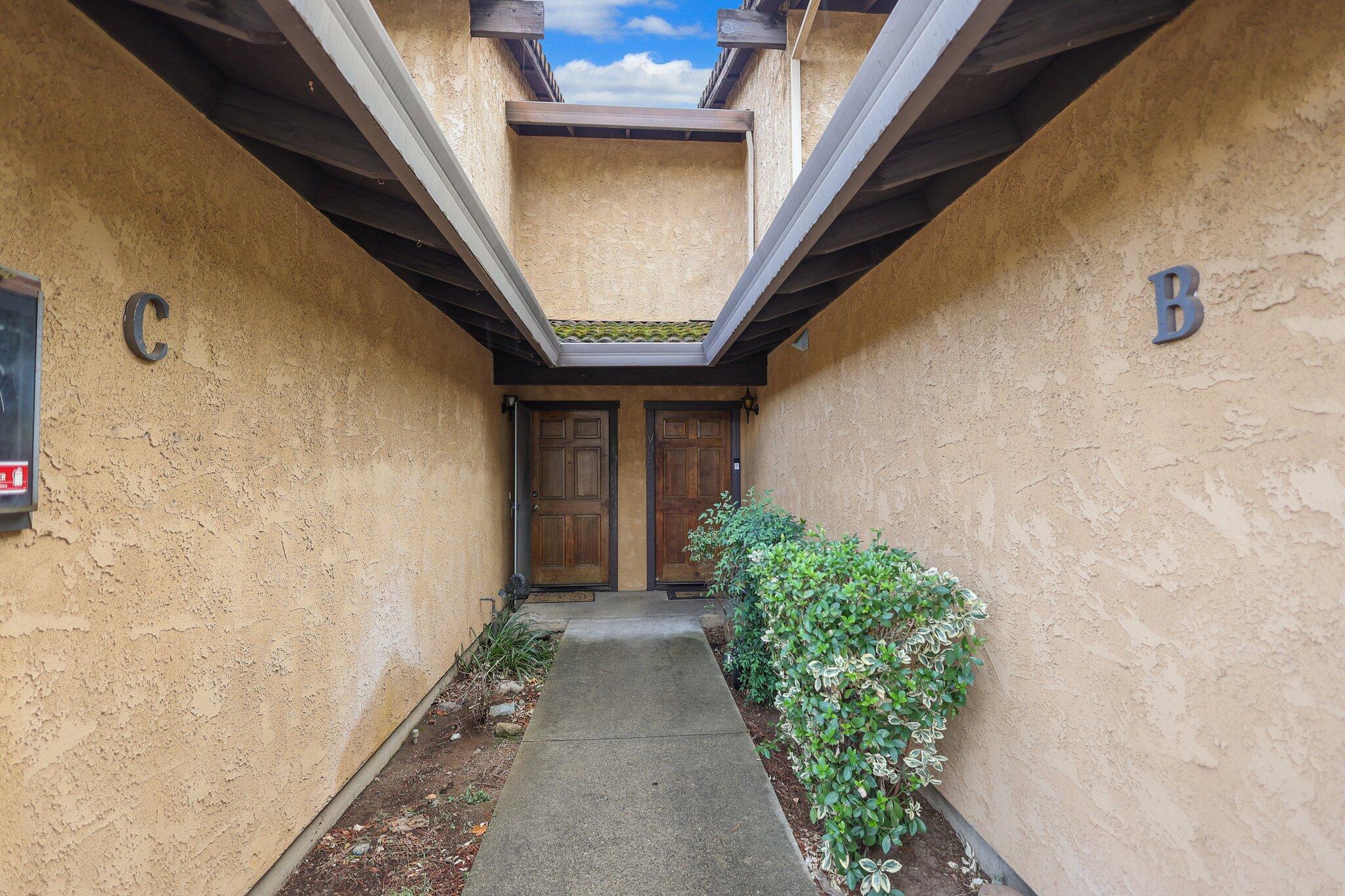1253 Brandon Court Redding, CA 96003 - Photo 17 of 19 a view of a pathway along the building