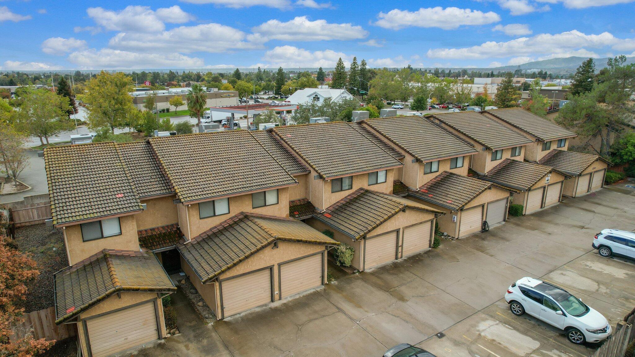 1253 Brandon Court Redding, CA 96003 - Photo 2 of 19 an aerial view of multiple houses with a yard