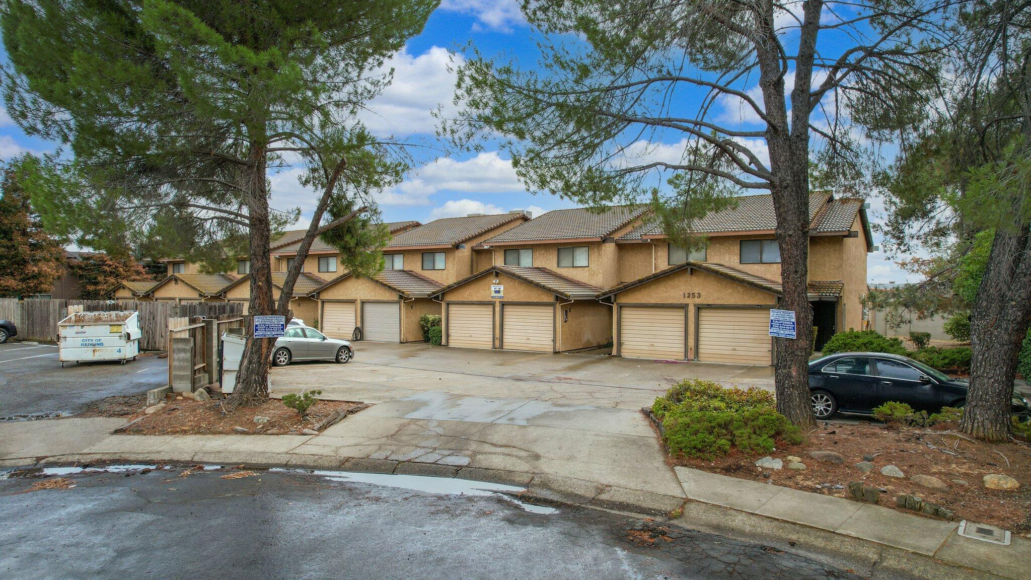 1253 Brandon Court Redding, CA 96003 - Photo 4 of 19 a house that has a tree in front of it
