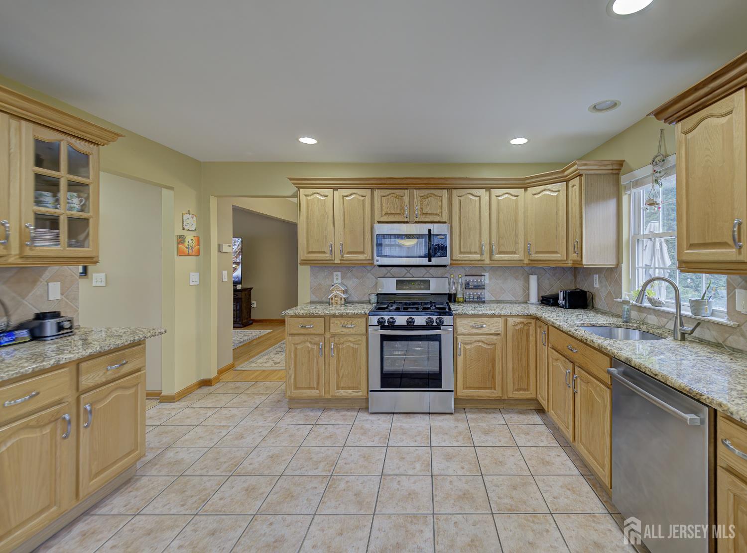 357 George Street South Amboy, NJ 08879 - Photo 22 of 36 a kitchen with stainless steel appliances granite countertop a sink stove and refrigerator