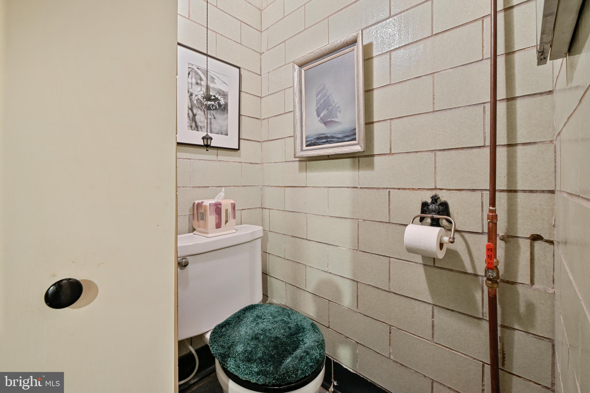 6420 Sherwood Road Baltimore, MD 21239 - Photo 36 of 49 Lower Level Powder Room