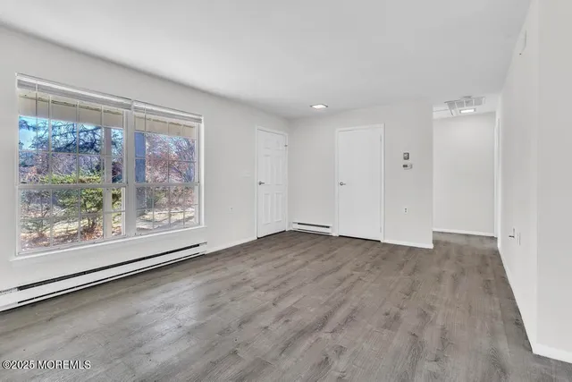 a view of kitchen with wooden floor