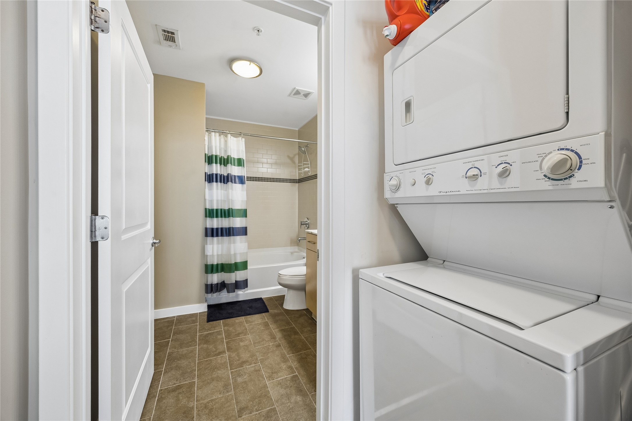 5925 Almeda Road, Unit 11011 Houston, TX 77004 - Photo 16 of 24 Stacked washer/dryer are conveniently located next to the primary bath.