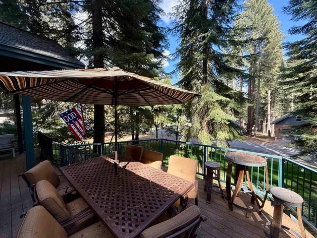 a view of a chairs and table in the patio