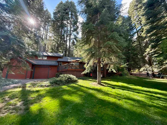 a backyard of a house with lots of green space