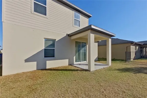 a view of a wooden door of the house