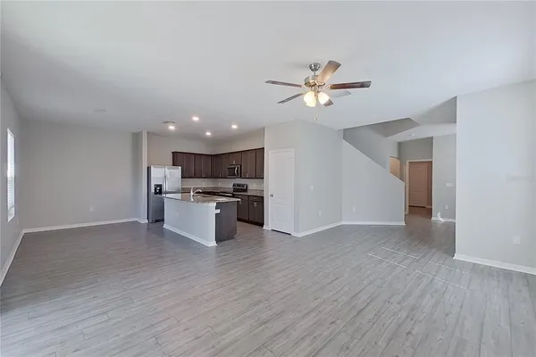 a kitchen with stainless steel appliances granite countertop a sink stove and cabinets
