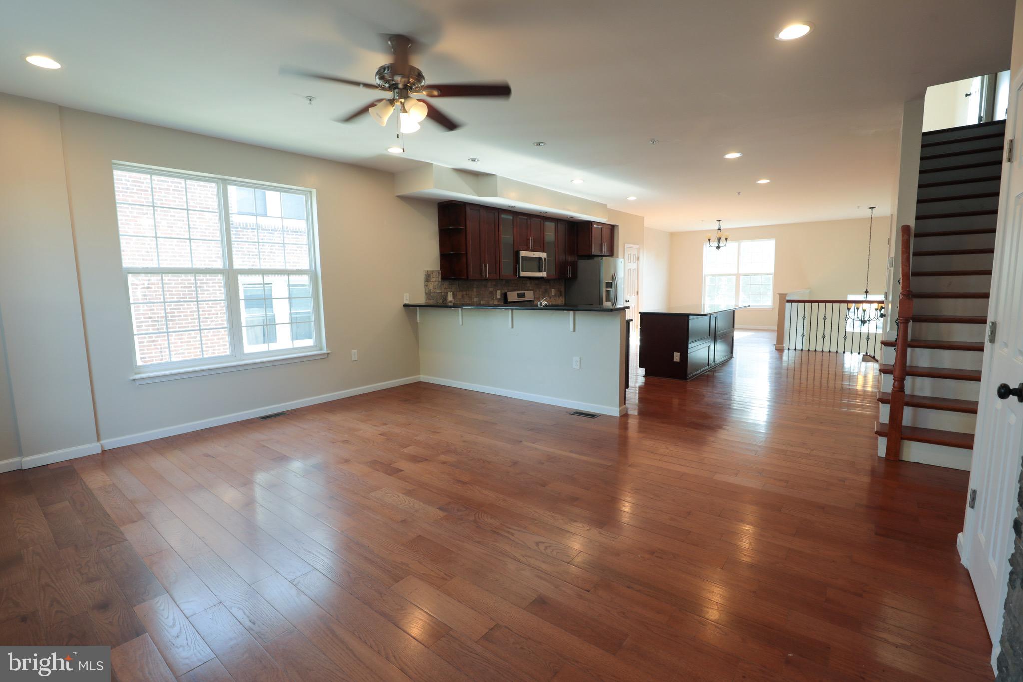 4779 Manayunk Avenue Philadelphia, PA 19128 - Photo 4 of 17 a view of empty room with wooden floor and a window