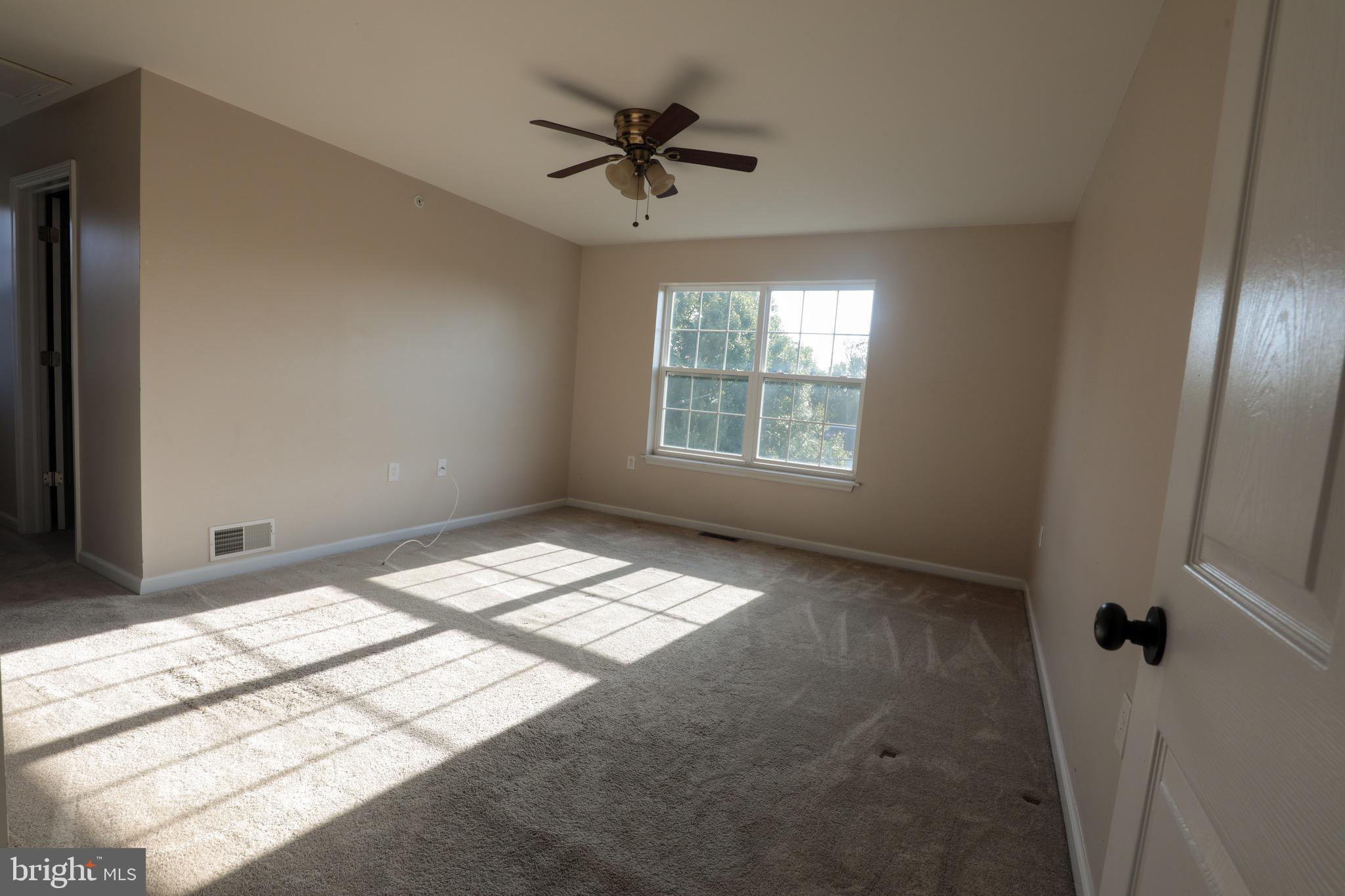 4779 Manayunk Avenue Philadelphia, PA 19128 - Photo 8 of 17 a view of room with a ceiling fan and window