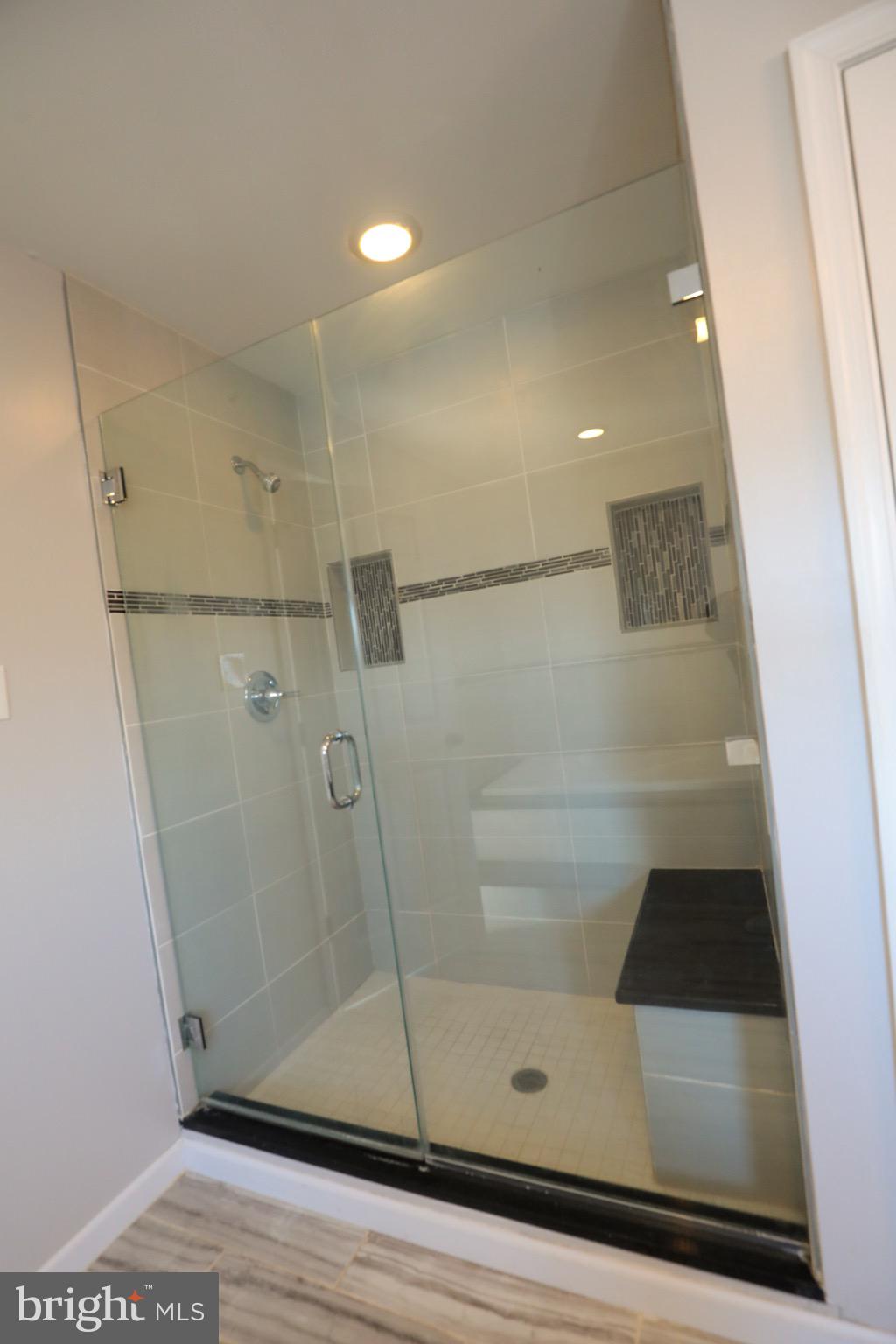 4779 Manayunk Avenue Philadelphia, PA 19128 - Photo 10 of 17 a bathroom with a glass shower door