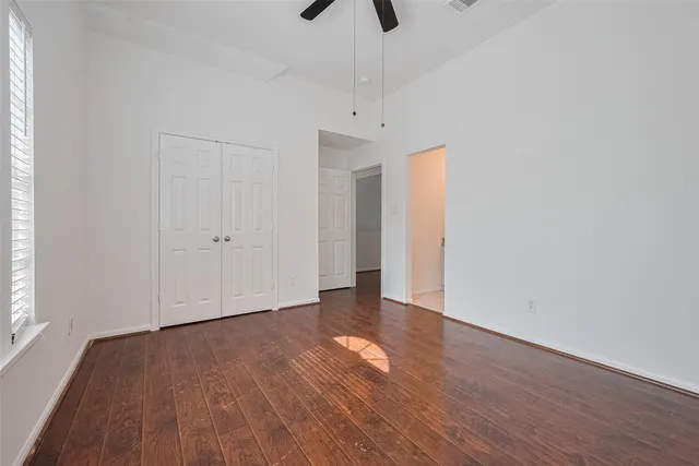 a bathroom with a granite countertop sink a mirror and bathtub