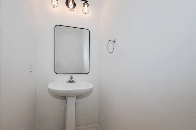 a view of a house with yard and a garden