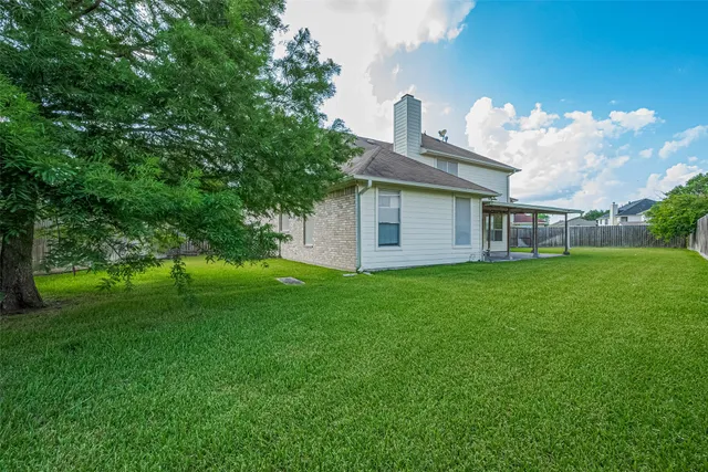 a view of a park with large trees