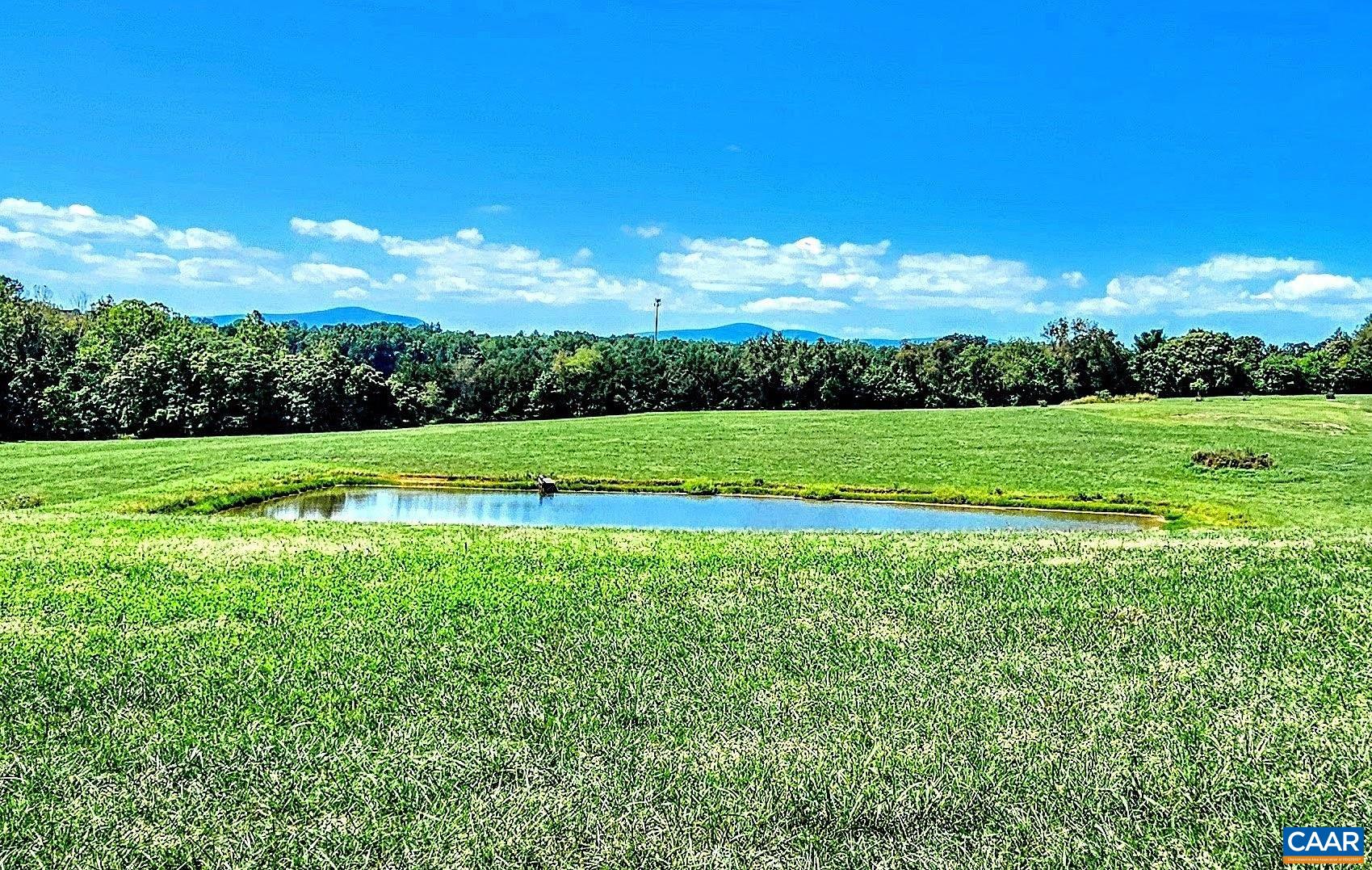 3470 Fredericksburg Road Ruckersville, VA 22968 - Photo 1 of 9 a view of a golf course with a big yard